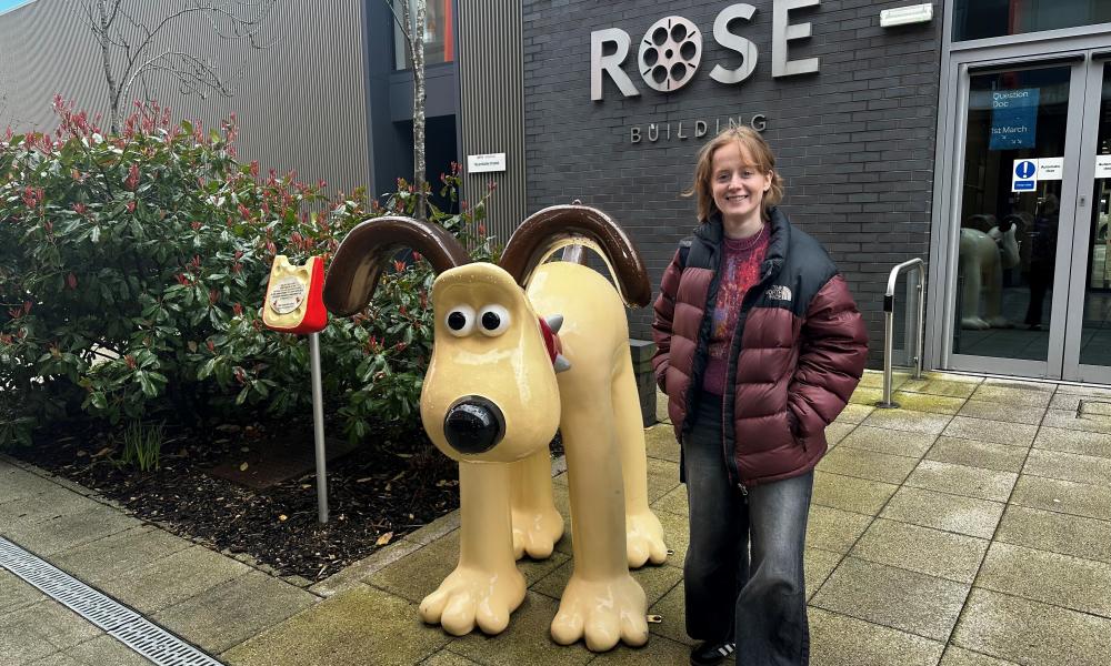 Emma standing with model Gromit at the NFTS