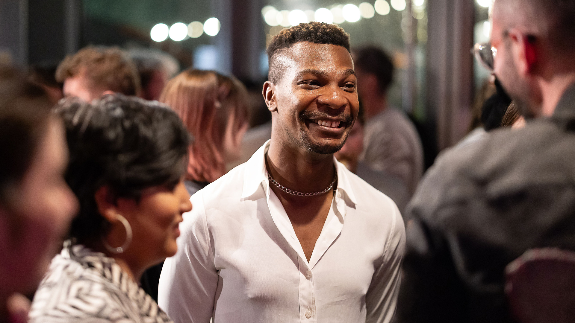 Alumni chatting at party