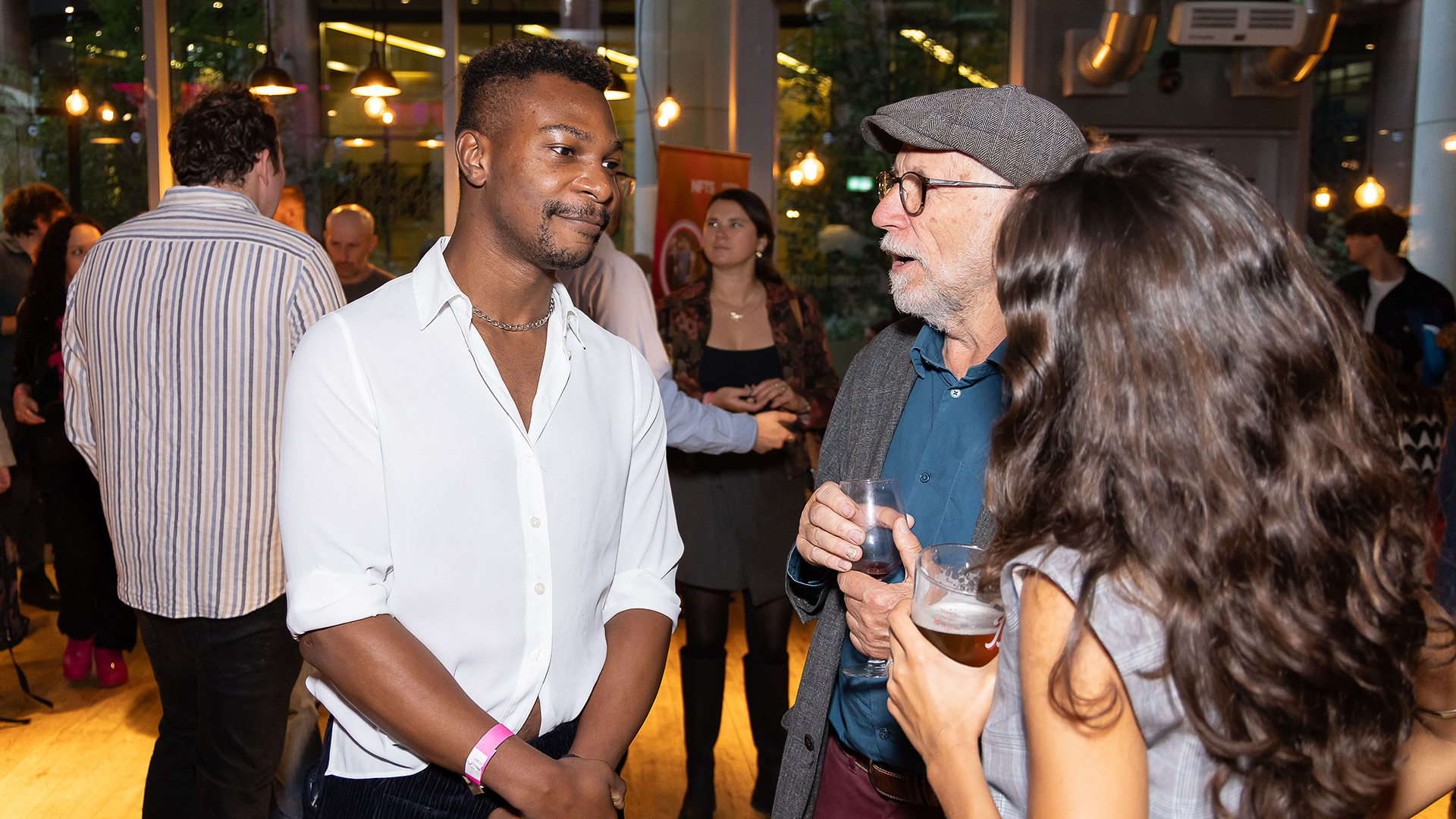 Alumni chatting over drinks