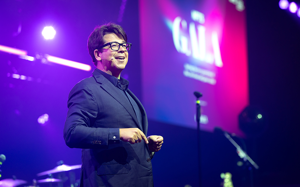 Host Michael McIntyre speaking on stage