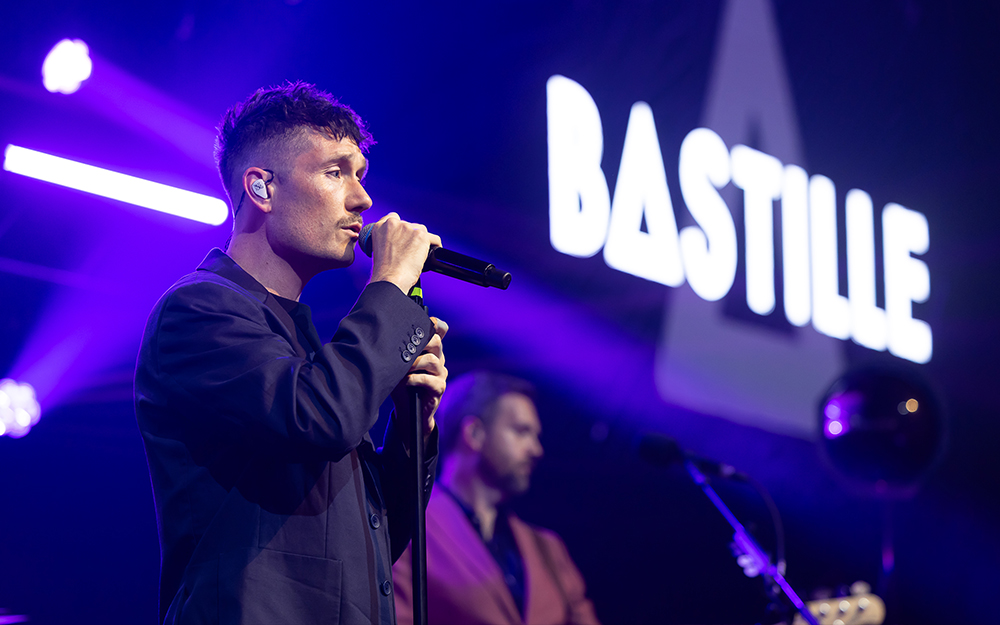 Bastille performing on stage