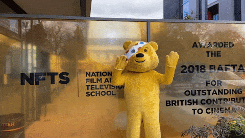 Pudsey standing by NFTS sign