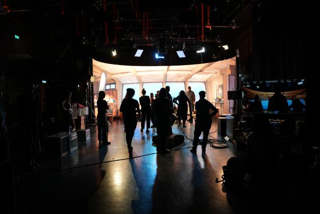 virtual production led volume with team of filmmakers silhouetted