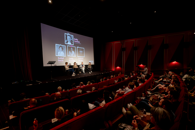 full cinema with panel on stage