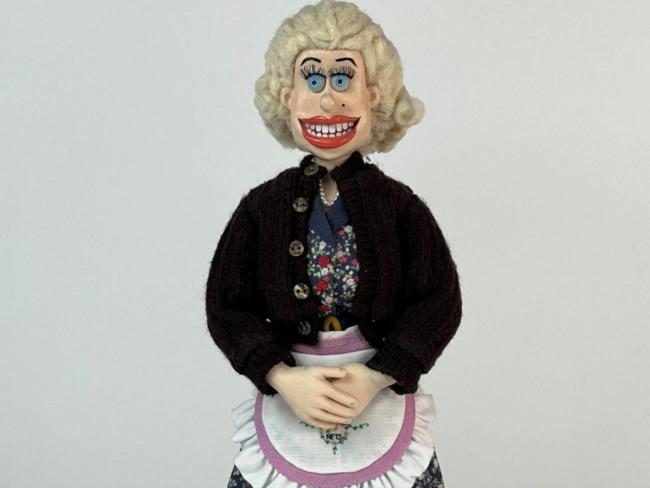 model of a smiling 1930s housewife