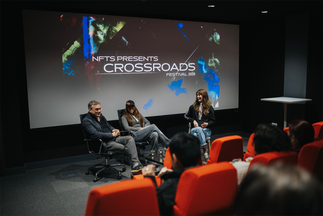 speakers in front of cinema audience