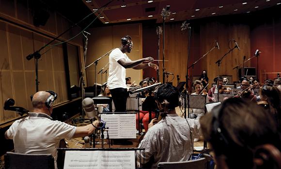 Segun Akinola composing and orchestra