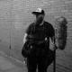 Mathew Birch stands next to wall with his sound kit