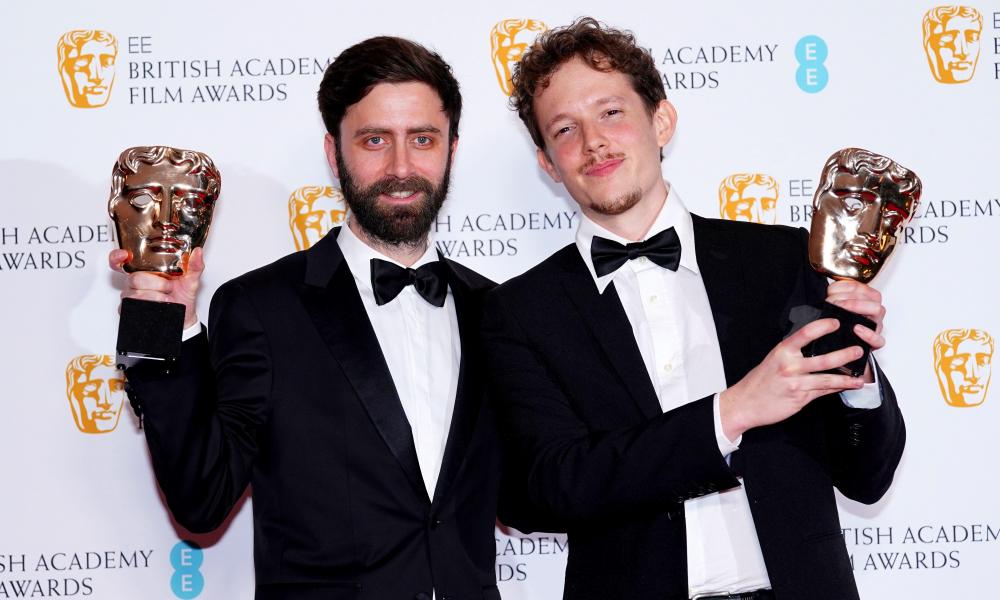 two men holding BAFTA awards