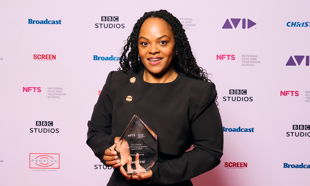Tracey Murray holding award