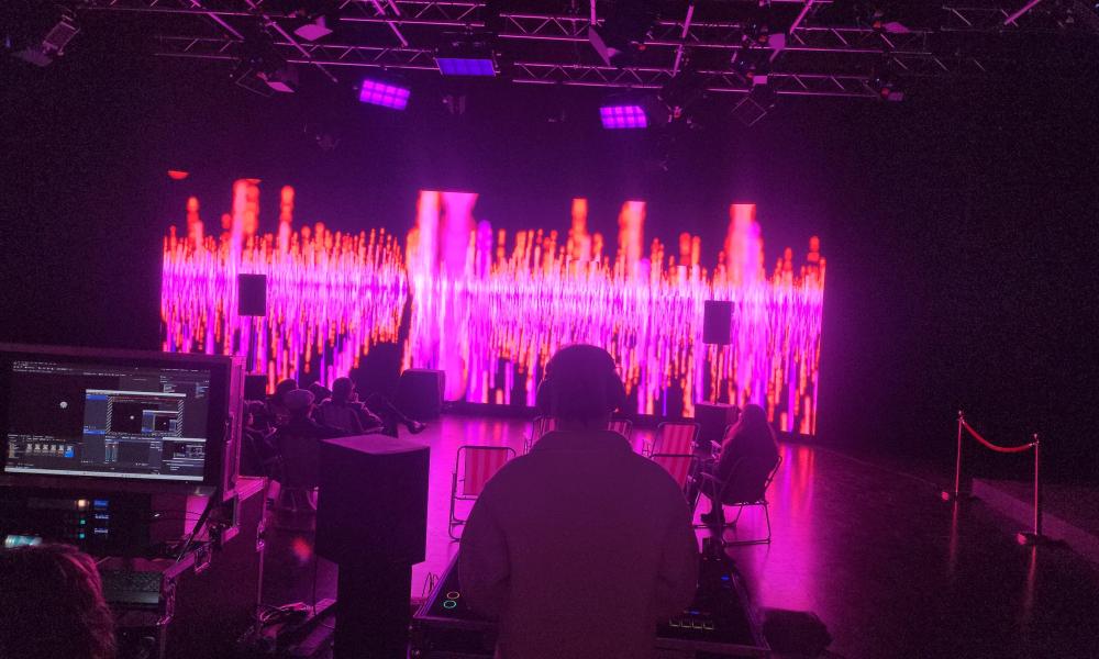 immersive experience in TV studio with graphics on VP wall