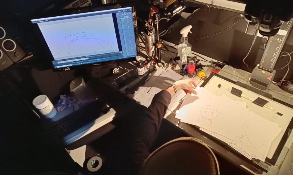 animation desk with drawings and lightbox