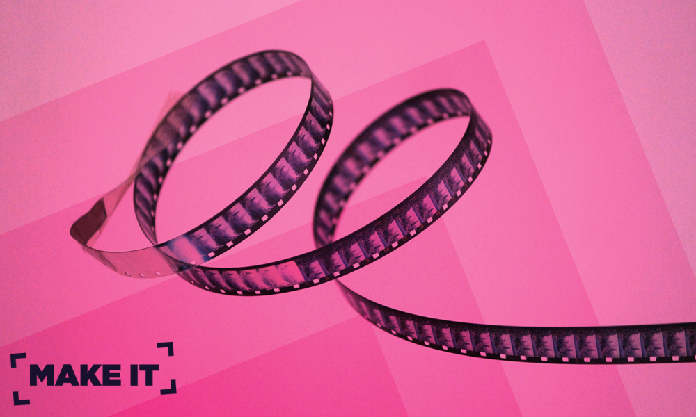film reel pink background