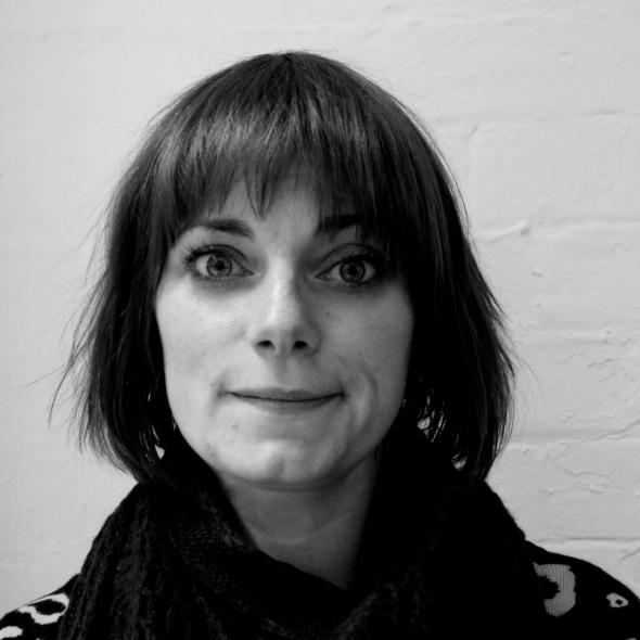 Black and white headshot of women with bobbed hair