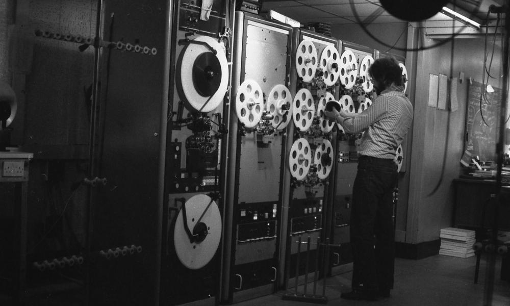 man working with film reels